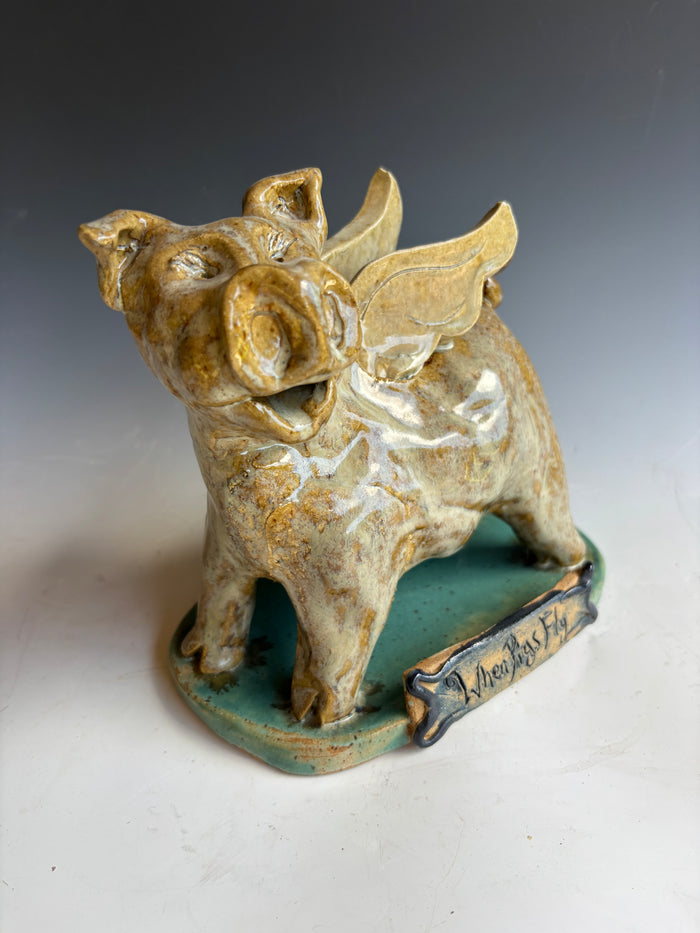7" tall When Pigs fly sculpture by Crystal King