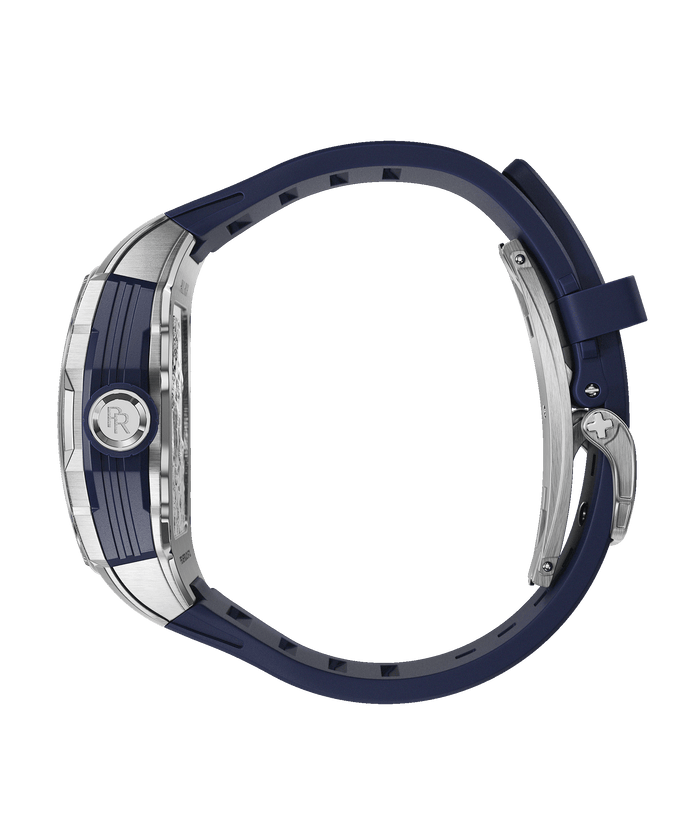 Side view of Paul Rich watch with blue rubber strap, stainless steel clasp, PR monogram crown, and tonneau-shaped case, shown closed.