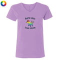Purple t-shirt with a colorful dog graphic and text 'Bark Less Love More' on a white background.