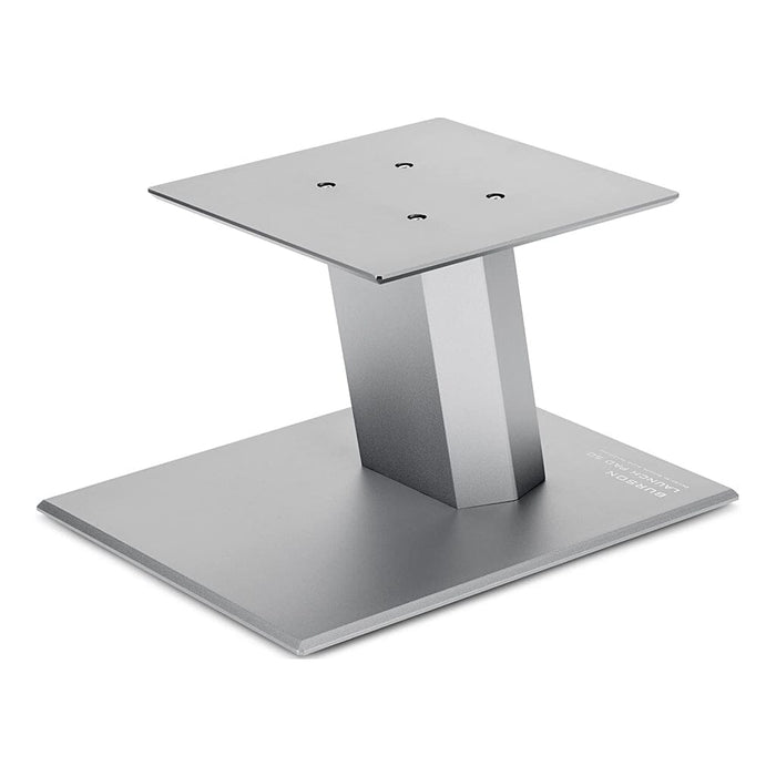 The Burson Audio Launch Pad 50 Desktop Speaker Stands (Pair) from Headphones.com feature a matte gray metal finish, rectangular base, angled support, and square mounting plate with four screw holes—perfect for bookshelf speakers.