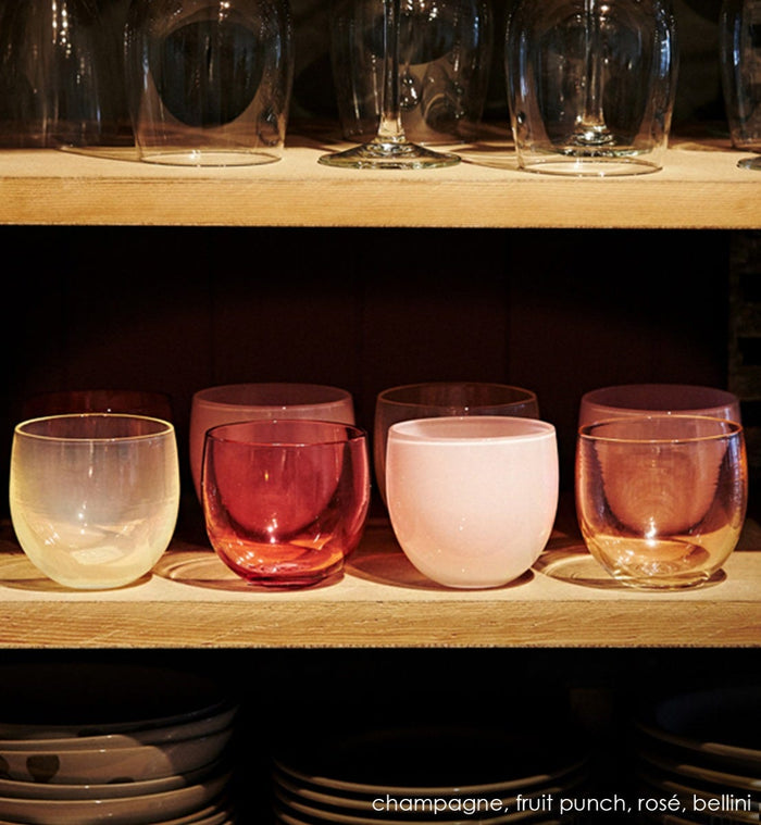 champagne drinker, ivory translucent, hand-blown drinking glass, paired with fruit punch transparent raspberry, rose opaque pale pink, bellini light transparent pink