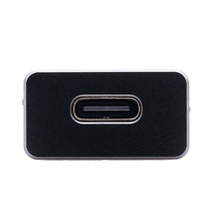Close-up of the USB-C port on the CrinEar Protocol Max, a black rectangular headphone amplifier by CrinEar, shown against a plain white background.
