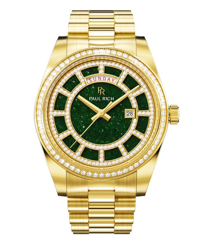 Gold watch with a green aventurine dial, day and date windows, and a bezel and hour markers set with clear stones on a full gold bracelet.