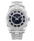 Silver watch with a blue aventurine dial, day and date windows, and a bezel and hour markers set with clear stones on a full stainless-steel bracelet.