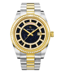 Two-tone silver and gold watch with a blue aventurine dial, day and date windows, and a bezel and hour markers set with clear stones.