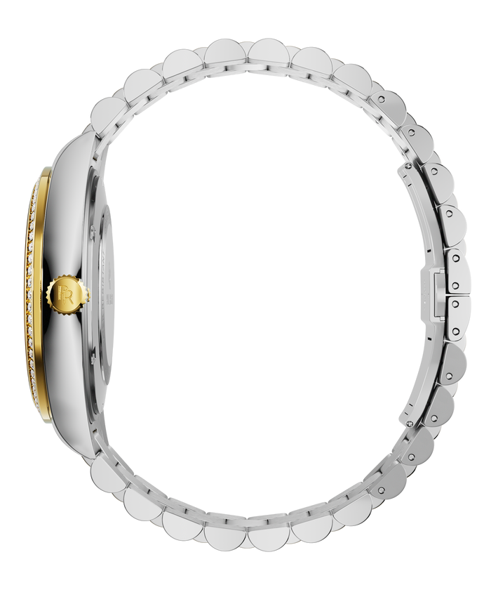 Side view of a silver watch with a gold crown engraved with the PR logo, a gold gem-set bezel, and a full stainless-steel bracelet.