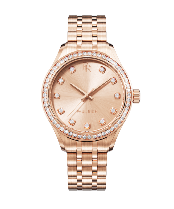 Front view of a rose gold Paul Rich watch with a matching rose gold sunray dial, diamond hour markers, gem-set bezel, and rose gold jubilee bracelet.