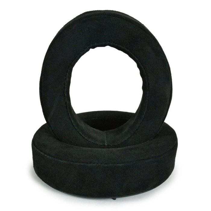 Two black, round Dekoni Audio Replacement Earpads for Focal Bathys, Bathys MG, Hadenys, Azurys, and Lensys are stacked together, showcasing their soft suede-like texture designed for enhanced comfort.