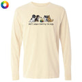 A cream-colored long-sleeve t-shirt with a graphic of four dogs and the text 'don't judge a bark by its size' printed on the chest. A small multicolor color wheel icon is visible in the top-left corner.