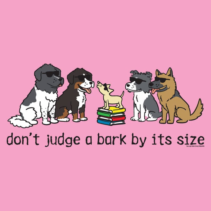 A pink graphic print featuring cartoon dogs of various sizes sitting around a small stack of books, with the text 'don't judge a bark by its size' underneath. A small '© www.
