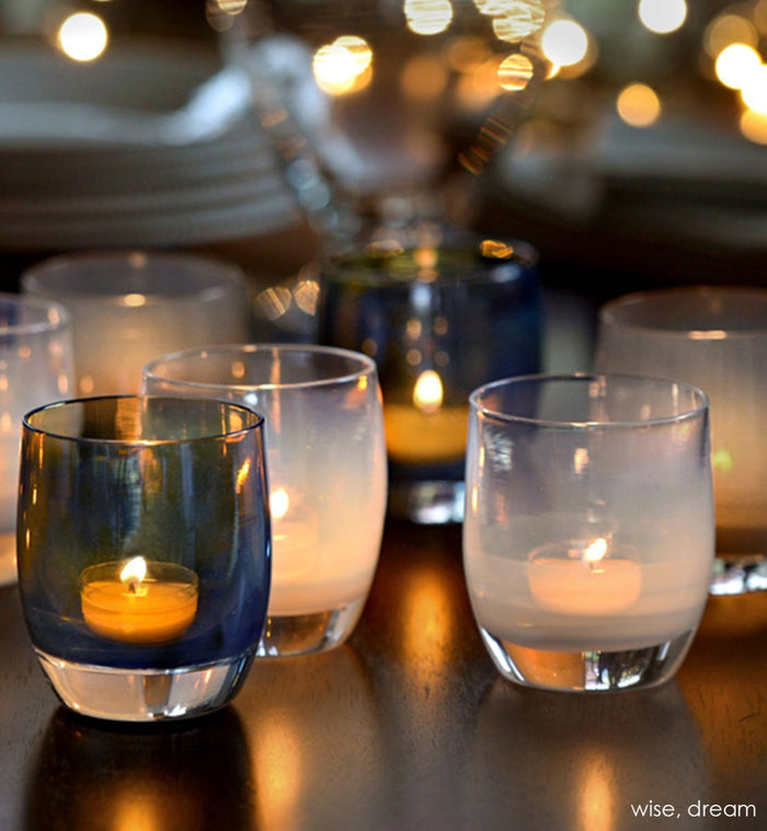 dream, clear white hand-blown glass votive candle holders. paired with wise on a wood dining table.
