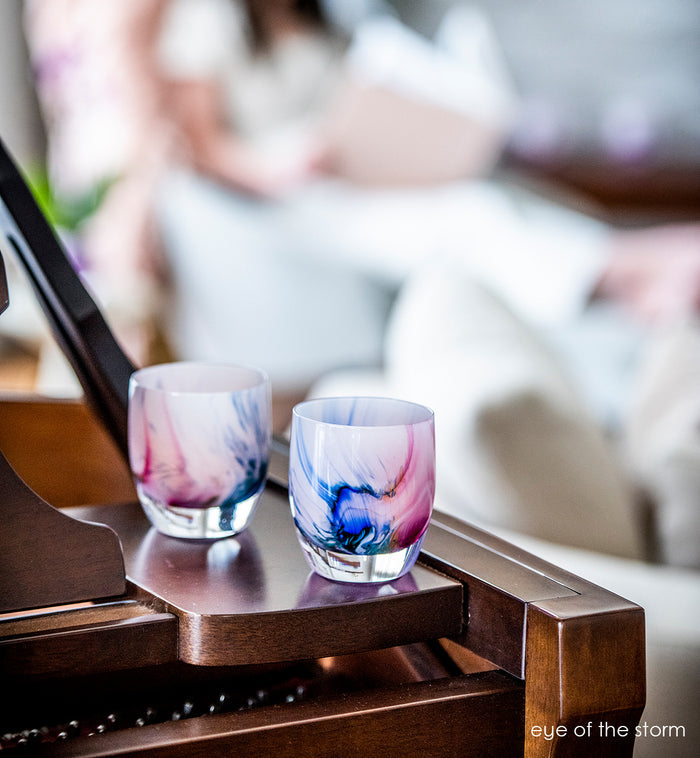 eye of the storm, multicolor texture moving through light lavender, hand-blown glass votive candle holder