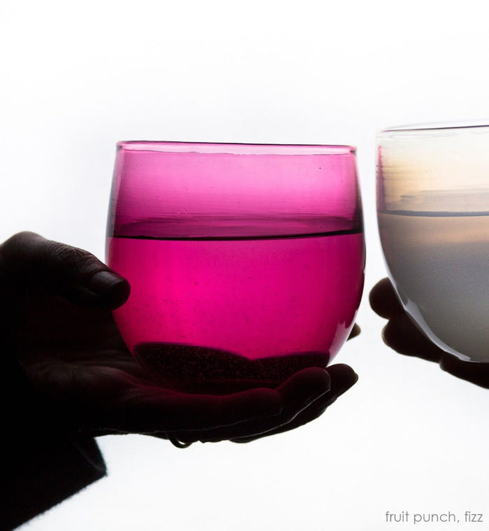 fruit punch drinker, transparent raspberry, hand-blown drinking glass toasting a fizz drinker.