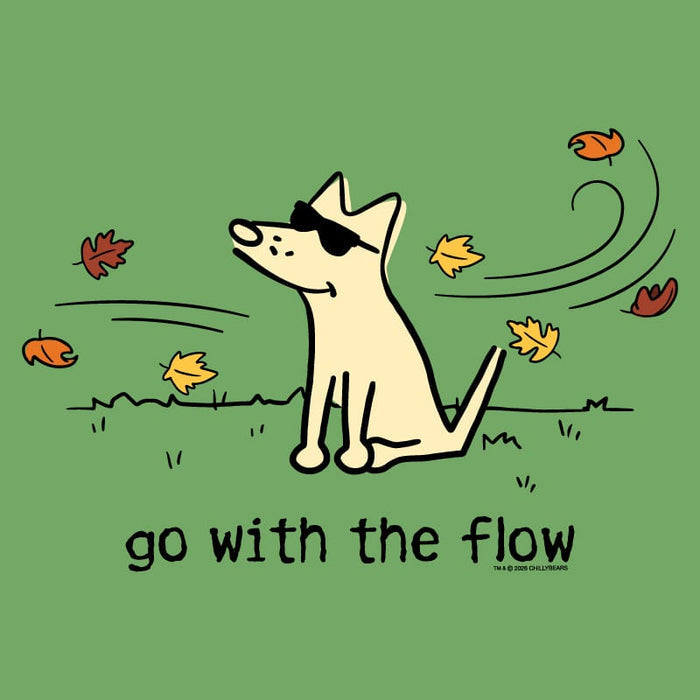 A green graphic print featuring a cartoon dog wearing black sunglasses, sitting on grass with falling autumn leaves around it and the text 'go with the flow' below. Small text at the bottom right reads '16+4 DREAM CHILDREN'.