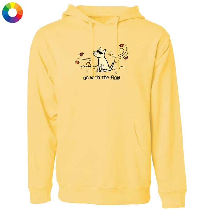 A pale yellow pullover hoodie with a front kangaroo pocket and a graphic of a dog with the text 'go with the flow' on the chest. A small multicolor color wheel icon is in the top-left corner.