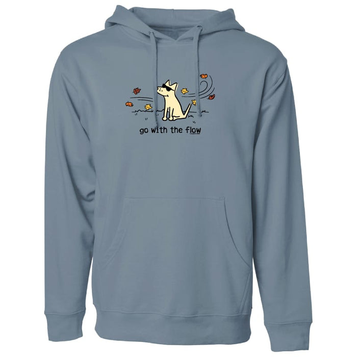 A dusty blue-gray pullover hoodie with a front graphic of a white dog sitting amidst autumn leaves, with the text 'go with the flow' printed below. The hoodie is shown against a plain white background.