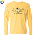 A pale yellow long-sleeve t-shirt with a graphic of a dog wearing sunglasses and the text 'go with the flow' printed on the chest, shown against a plain white background.