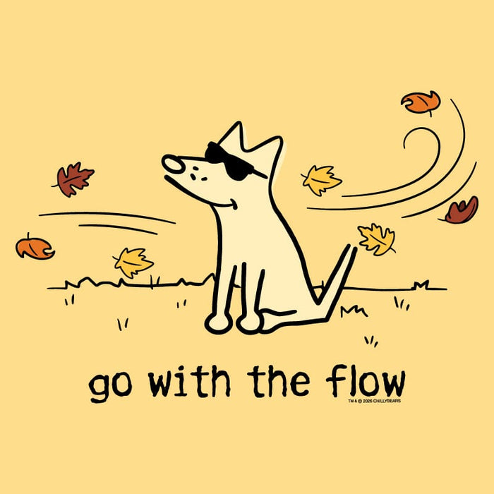 A minimalist line-art illustration of a light cream dog wearing black sunglasses, sitting on a pale yellow background with scattered autumn leaves and the text 'go with the flow' below. Small copyright text at the bottom right reads 'TBA & KEN CHALMERS'.