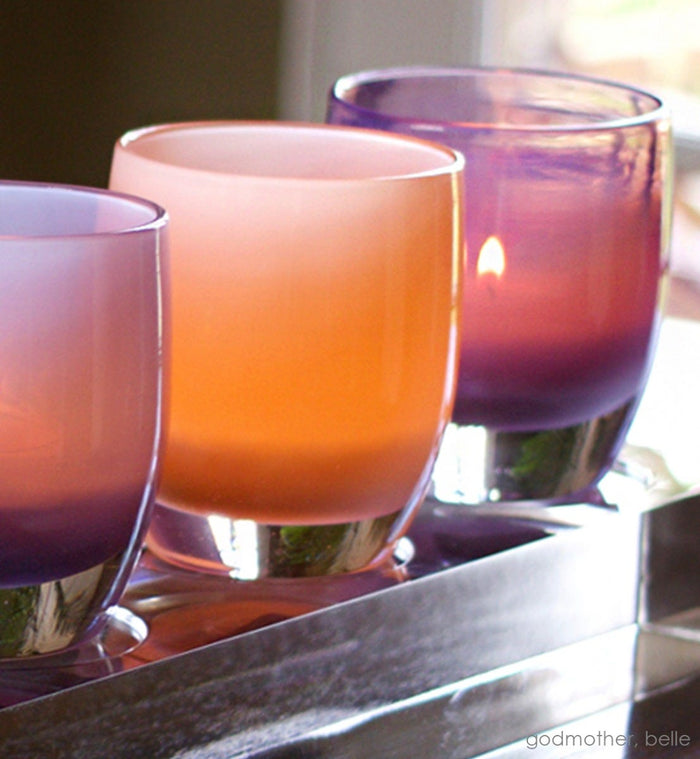 godmother, peach hand-blown glass votive candle holder. Paired with belle on an acrylic square stand.
