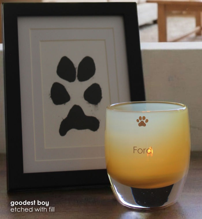 'goodest boy' and 'goodest girl' candle holders etched with name Ford and a paw print.