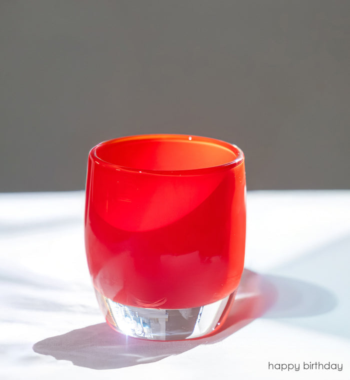 happy birthday bright red, hand-blown glass votive candle holder.
