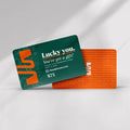 A green and orange headphones.com Gift Card worth $75 is shown, featuring “Lucky you. You’ve got a gift!” in playful graphics—a modern treat to redeem for premium audio gear.