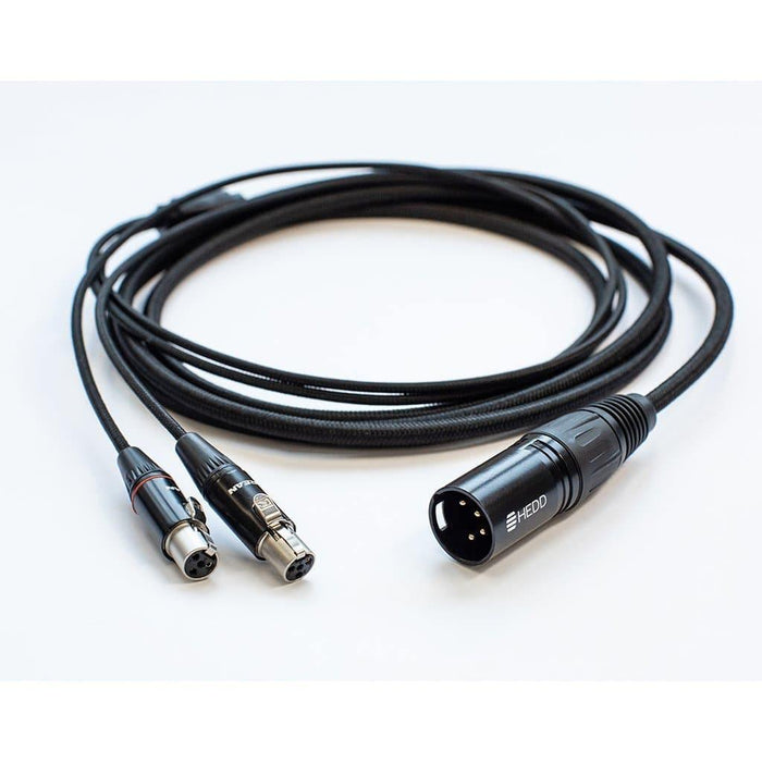 The HEDD Audio HEDDphone Balanced 4-Pin XLR Cable, coiled on a white surface, features a single 4-pin XLR connector for easy connection of your HEDDphone to a headphone amplifier.