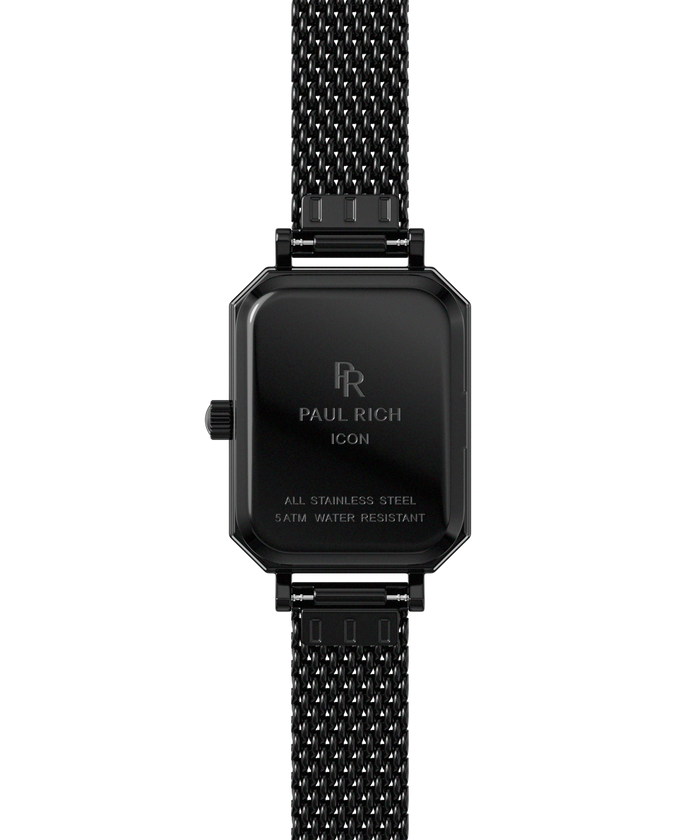 Back view of a black Paul Rich watch with rectangular case engraved with “Paul Rich ICON,” “All Stainless Steel,” and “5ATM Water Resistant,” shown with a black mesh strap.