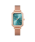 Front view of a rose gold Paul Rich watch with an emerald green sunray dial, gem-set octagonal bezel, and rose gold mesh strap.