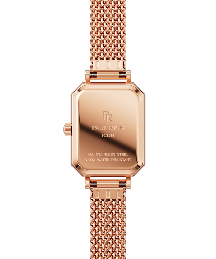 Back view of a rose gold Paul Rich watch with rectangular case, engraved with “Paul Rich ICON,” “All Stainless Steel,” and “5ATM Water Resistant,” shown with a rose gold mesh strap.