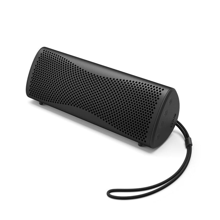 The KEF Muo HiFi Portable Bluetooth Speaker by KEF, shown in black with a curved design, perforated grille, side buttons, and wrist strap on a white background, offers portable waterproof sound—perfect for music anywhere.