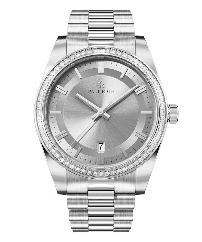 Front view of a silver-tone Paul Rich watch with silver sunray dial, diamond-set bezel, silver hour markers and hands, date display at 6 o'clock, and silver link bracelet.