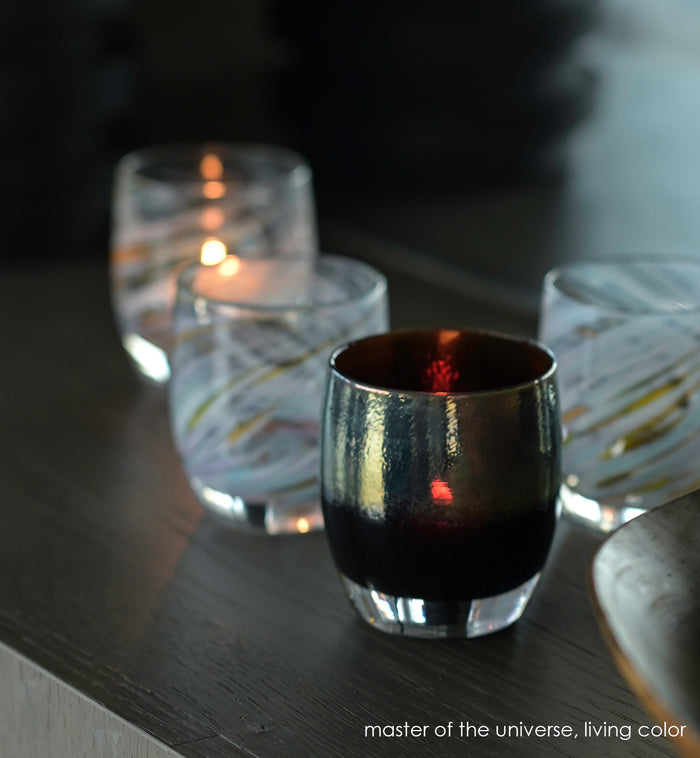 master of the universe silver on brown hand-blown glass votive candle holder. Paired with living color.