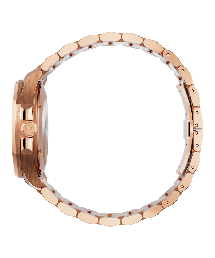 Side view of Paul Rich watch with brushed rose gold case, PR monogram crown, and polished rose gold bracelet closed in a full circle.