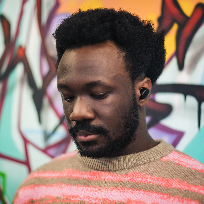 Mojo 300 earbud in man's ear