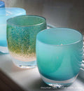 mountain lake blue hand-blown glass votive candle holder. Paired with mother earth and ocean.