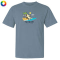 Blue t-shirt with a beach graphic and text on a white background