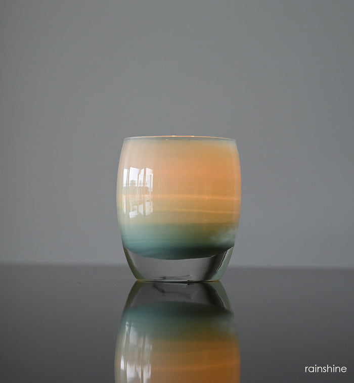 rainshine light teal hand-blown glass votive candle holder.