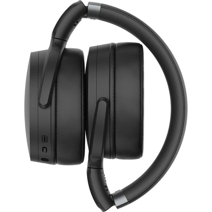 The Sennheiser HD 450BT wireless over-ear headphones in black are shown folded from the side against a white background, featuring visible control buttons and ports on the left ear cup for superior sound quality.