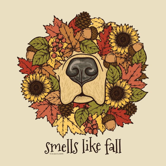 A circular autumn-themed illustration featuring a dog's nose at the center, surrounded by sunflowers, maple leaves, acorns, pinecones, and berries, with the text 'smells like fall' below on a beige background.