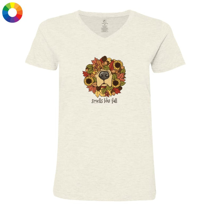 An off-white heathered v-neck t-shirt featuring a graphic of a dog's face surrounded by autumn leaves and sunflowers, with the text 'smells like fall' underneath. A small multicolor color wheel icon is visible in the top-left corner.