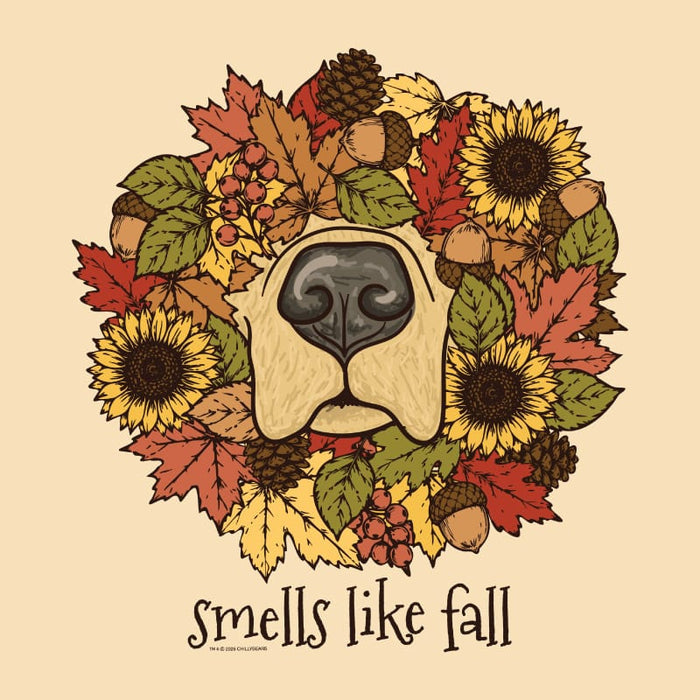 A circular autumn-themed illustration featuring a dog nose surrounded by sunflowers, maple leaves, acorns, pinecones, and berries, with the text 'smells like fall' below on a warm beige background.
