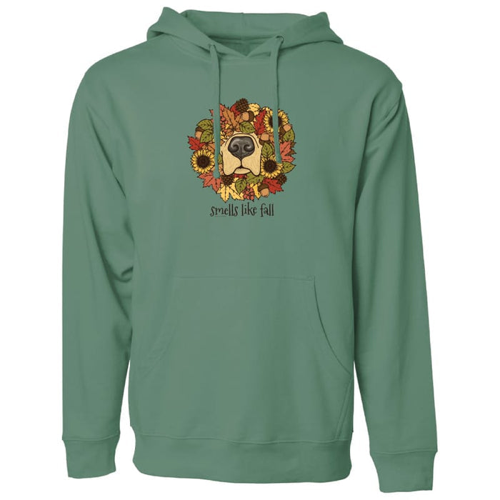 A sage green pullover hoodie with a front kangaroo pocket and drawstring hood, featuring a graphic of a dog's face surrounded by autumn leaves and sunflowers with the text 'dogs like fall' printed on the chest.