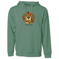 A sage green pullover hoodie with a front kangaroo pocket and drawstring hood, featuring a graphic of a dog's face surrounded by autumn leaves and sunflowers with the text 'dogs like fall' printed on the chest.
