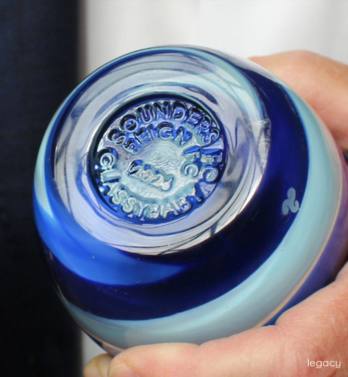 Close-up of a Sounders Reign FC and glassybaby stamp