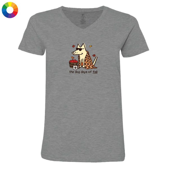 A heather gray V-neck t-shirt featuring a cartoon graphic of a dog wearing sunglasses and a checkered blanket, sitting next to a cupcake with the text 'the dog days of fall'.
