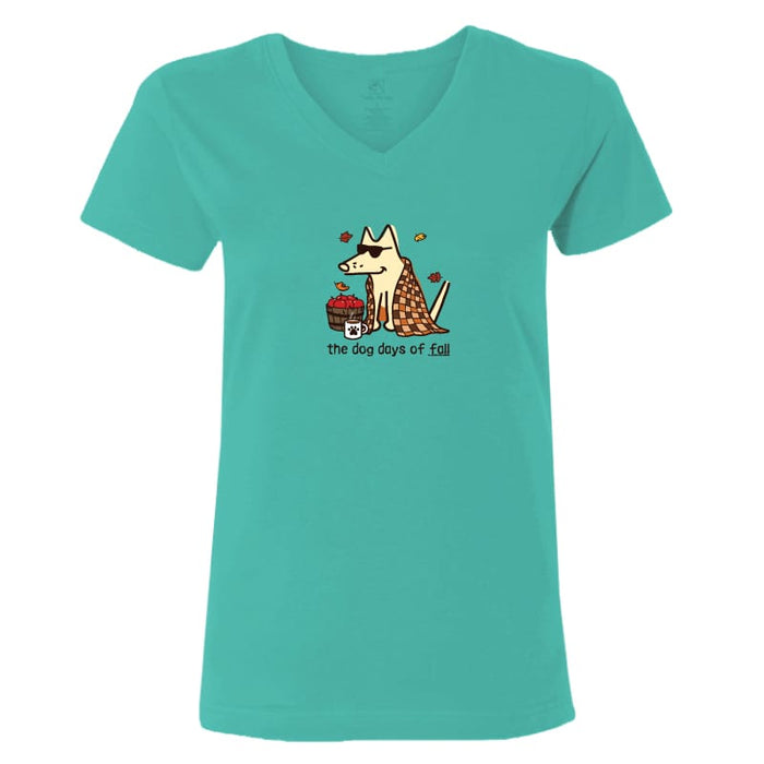 A women's short-sleeve V-neck t-shirt in a vibrant teal color, featuring a cartoon graphic of a fox wearing sunglasses and a patterned shirt next to a red cup, with the text 'the dog days of fall' printed below.