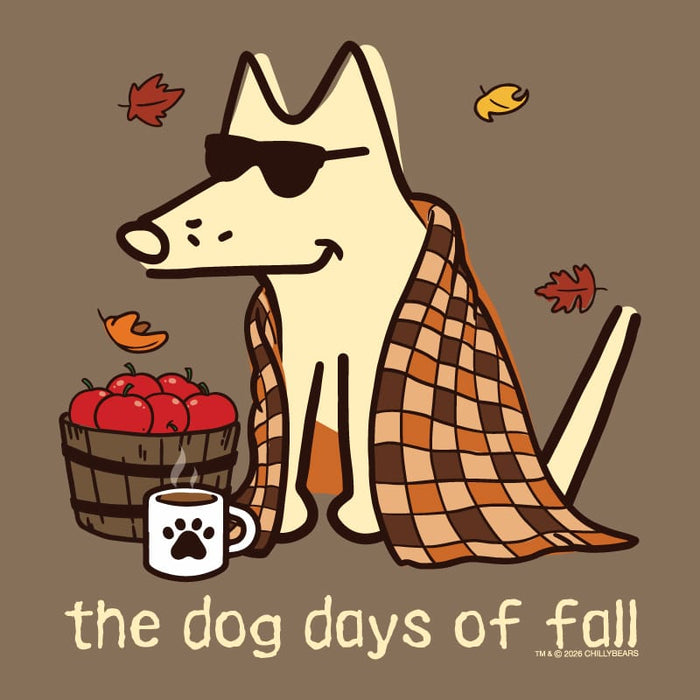 A stylized fall-themed illustration of a cream-colored dog wearing black sunglasses, wrapped in an orange and brown plaid blanket, sitting beside a basket of red apples and a white mug with a black paw print. The text 'the dog days of fall' appears at the bottom on a solid brown background.
