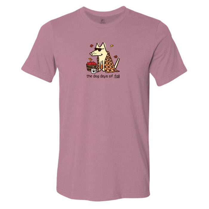 A heathered dusty rose short-sleeve t-shirt with a graphic of a dog wearing a leopard-print coat next to a basket of red apples, with the text 'the dog days of fall' printed below.