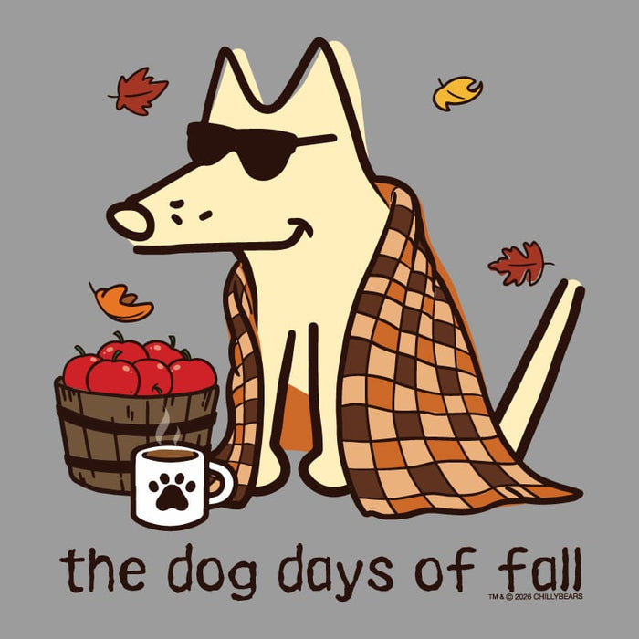 A stylized fall-themed illustration on a gray background showing a cream-colored dog wearing dark sunglasses, wrapped in an orange and brown plaid blanket, with red apples in a basket, a white mug with a paw print, and the text 'the dog days of fall'.